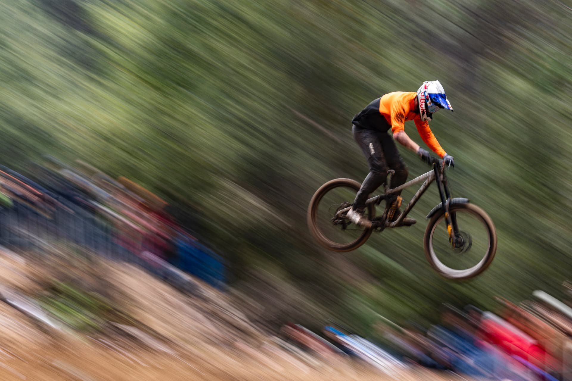 Downhill racer at speed over the race course, motion blur